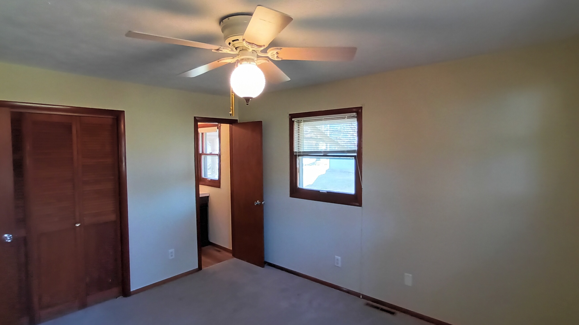 1633 Erin Drive Normal, IL 61761 - Photo 22 of 46 an empty room with windows and fan