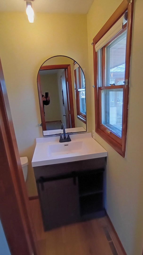 1633 Erin Drive Normal, IL 61761 - Photo 24 of 46 a room with a table and mirror