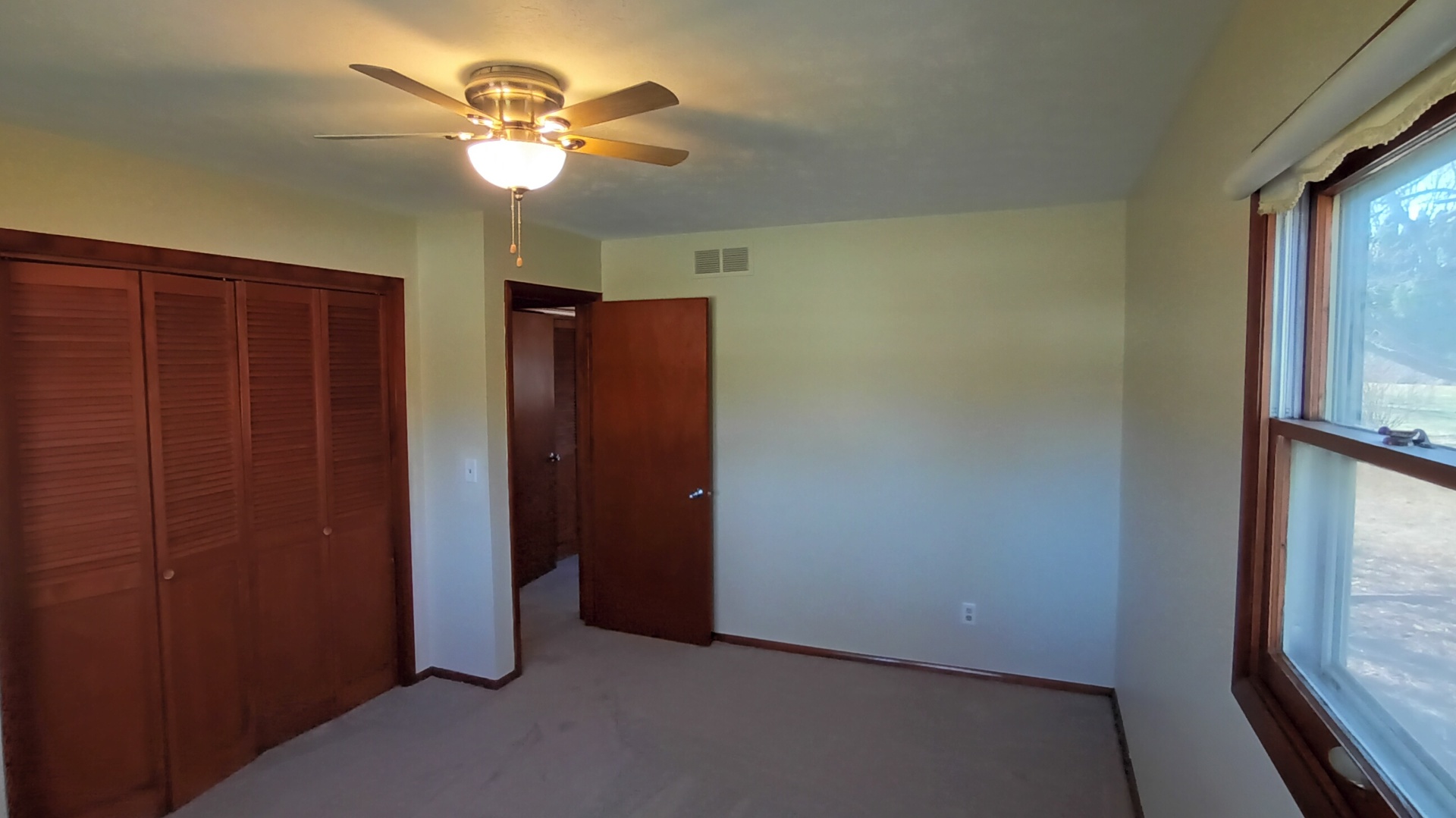 1633 Erin Drive Normal, IL 61761 - Photo 31 of 46 an empty room with windows and fan