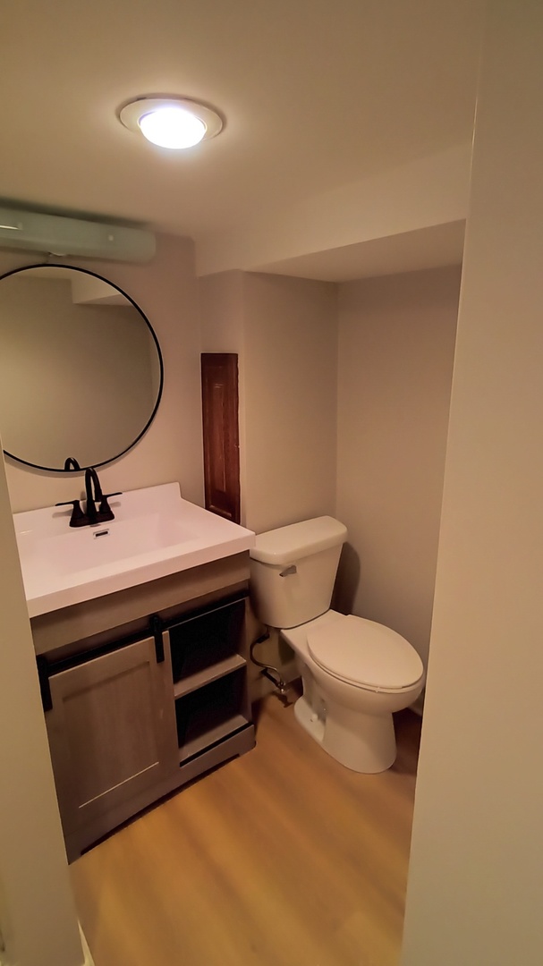 1633 Erin Drive Normal, IL 61761 - Photo 33 of 46 a bathroom with a sink and a toilet