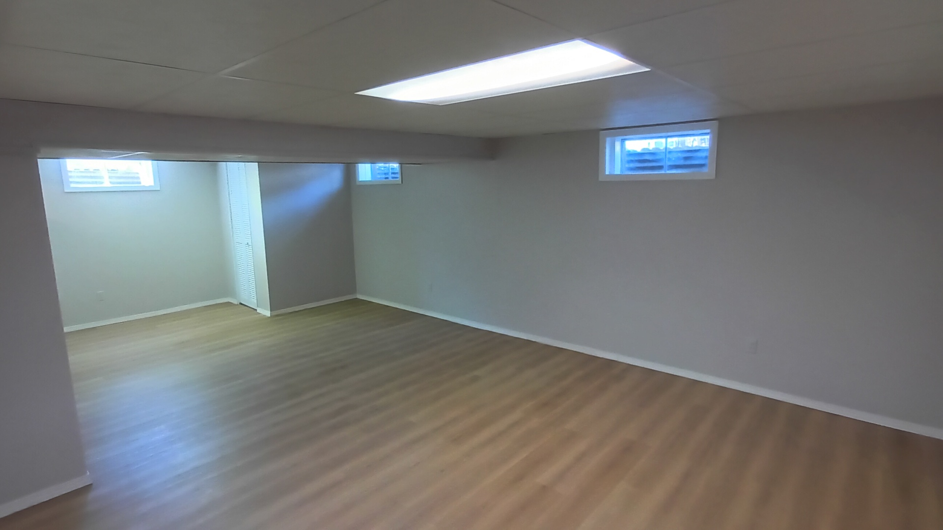 1633 Erin Drive Normal, IL 61761 - Photo 37 of 46 an empty room with wooden floor and windows