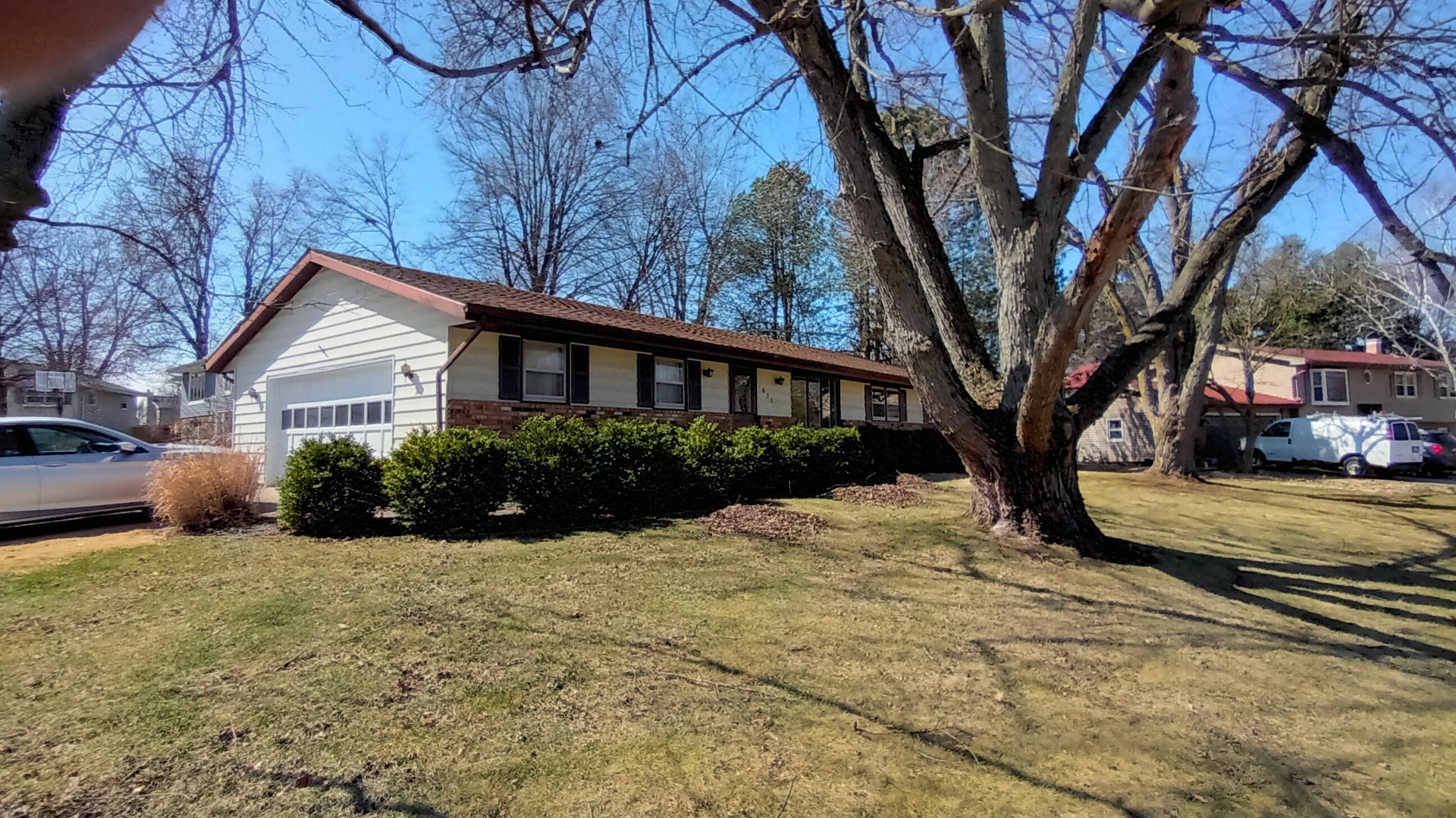 1633 Erin Drive Normal, IL 61761 - Photo 5 of 46 a view of a house with a yard covered in snow