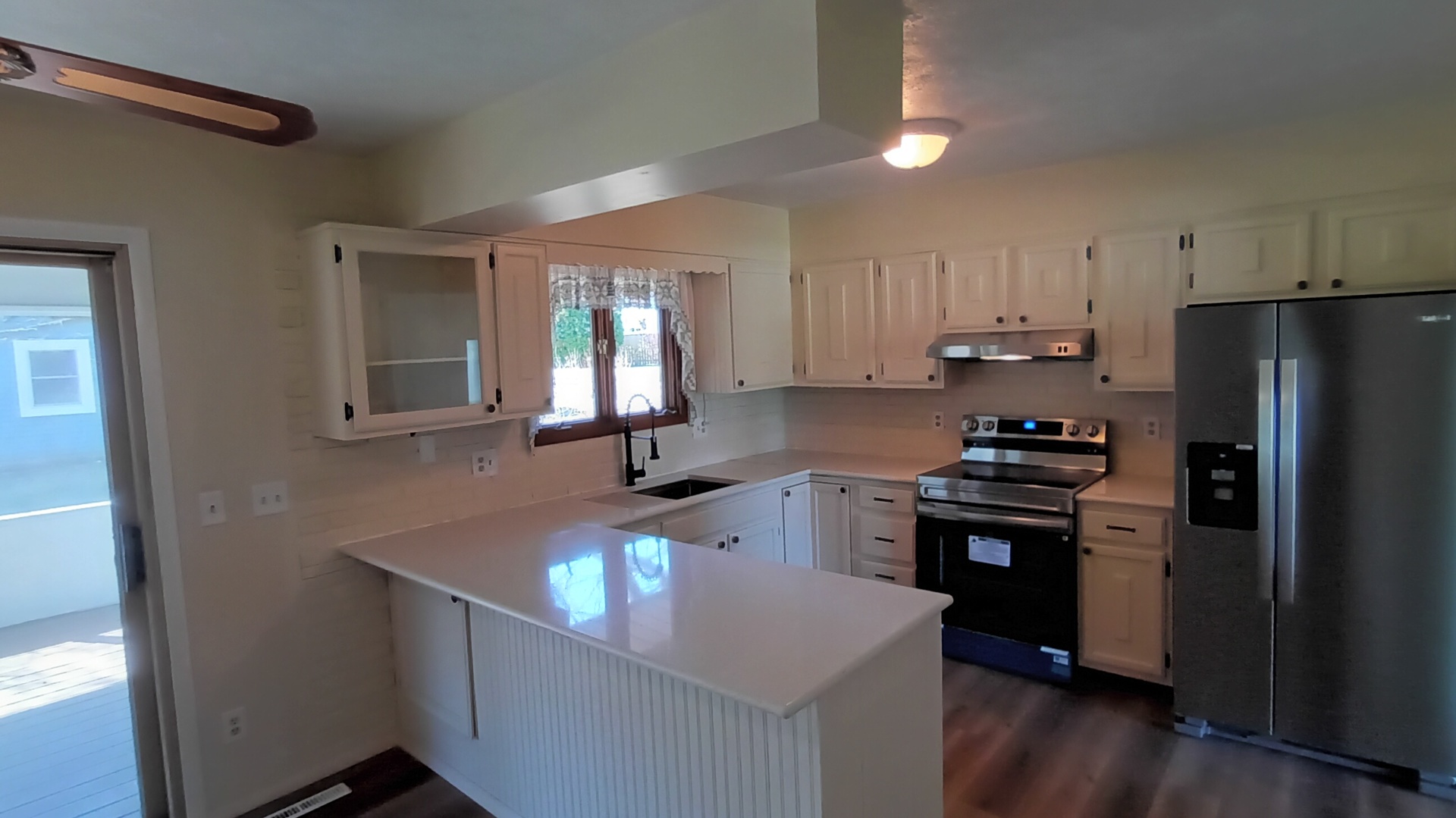 1633 Erin Drive Normal, IL 61761 - Photo 6 of 46 a kitchen with kitchen island granite countertop a sink cabinets and stainless steel appliances