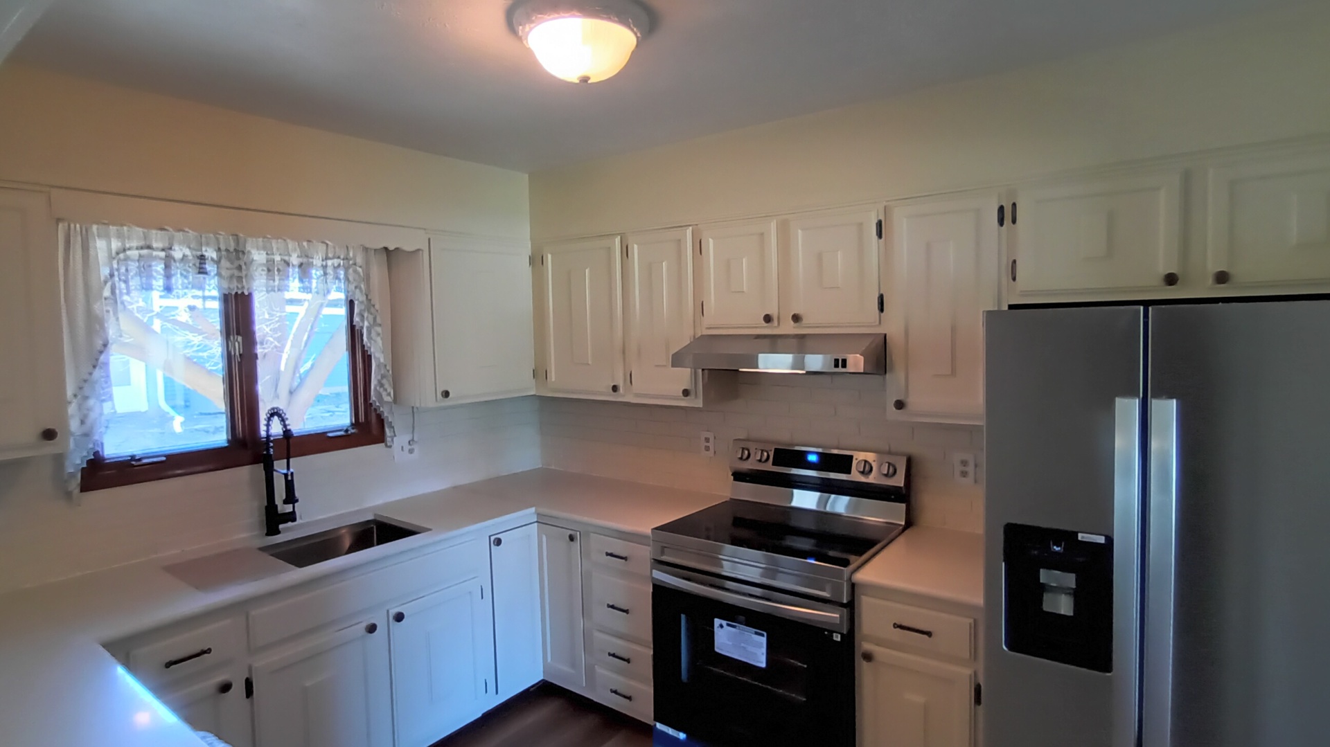 1633 Erin Drive Normal, IL 61761 - Photo 10 of 46 a kitchen with stainless steel appliances granite countertop a refrigerator sink and stove
