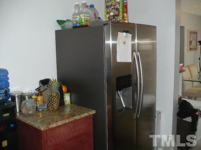 1311 Bethel Road Raleigh, NC 27610 - Photo 15 of 24 a kitchen with a refrigerator and countertop
