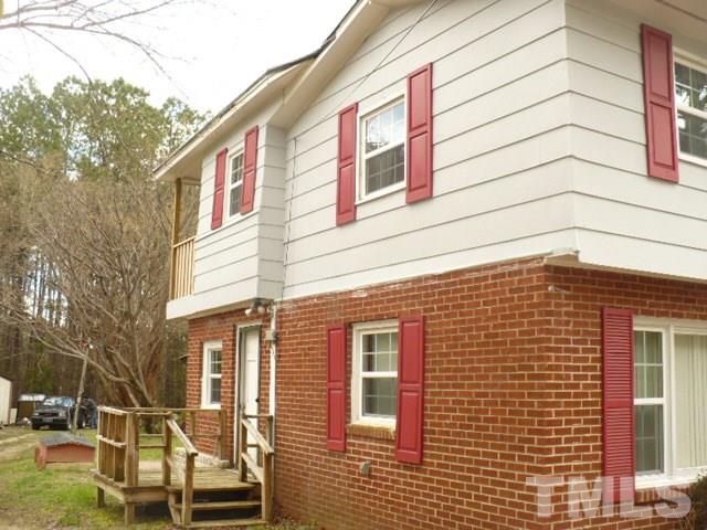 1311 Bethel Road Raleigh, NC 27610 - Photo 24 of 24 front view of a house with a street