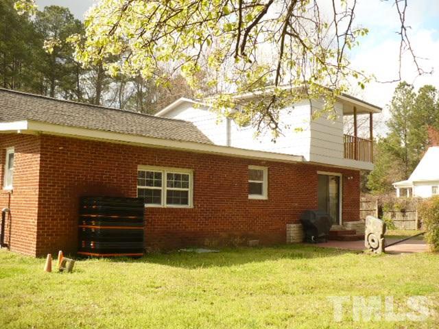 1311 Bethel Road Raleigh, NC 27610 - Photo 5 of 24 a view of a house with a yard