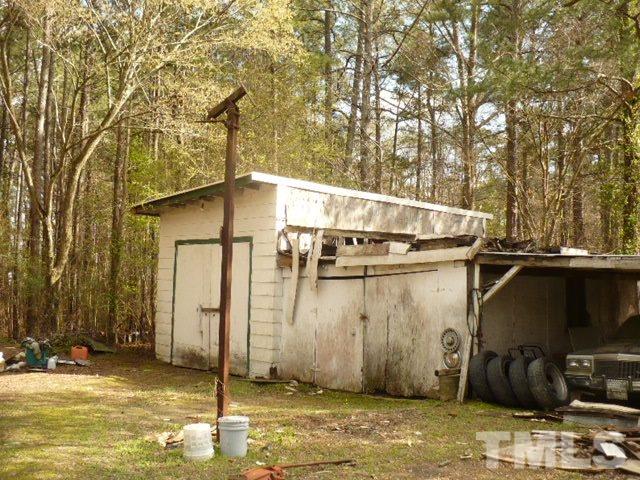 1311 Bethel Road Raleigh, NC 27610 - Photo 7 of 24 a backyard of a house