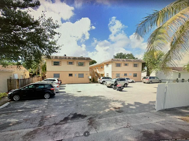 a view of street with parked cars