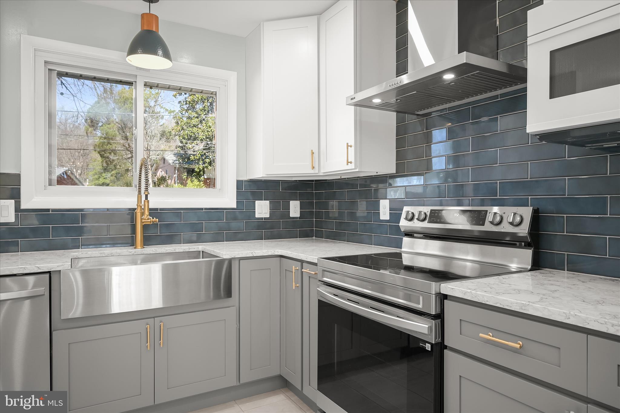 9720 Hedin Drive Silver Spring, MD 20903 - Photo 18 of 79 a kitchen with a stove and a sink