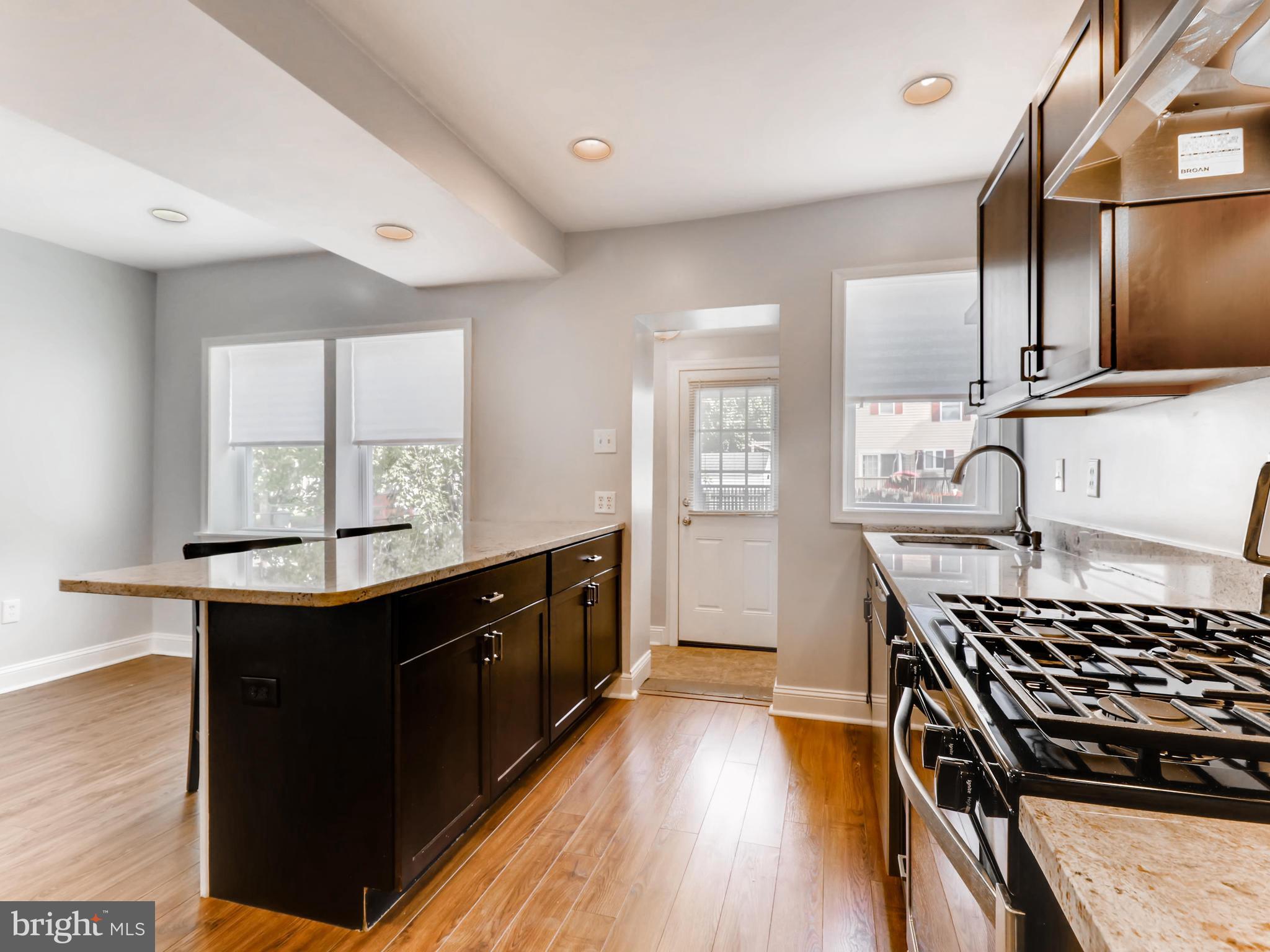7042 Dunbar Road Dundalk, MD 21222 - Photo 12 of 28 Kitchen Island/Bar w plenty of cabinet space