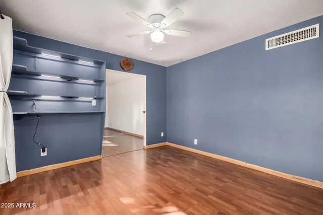 a view of kitchen with sink and refrigerator