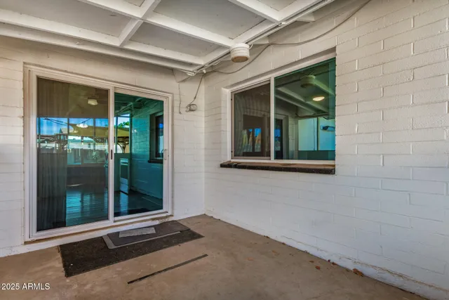 a outdoor living space with patio furniture and potted plants