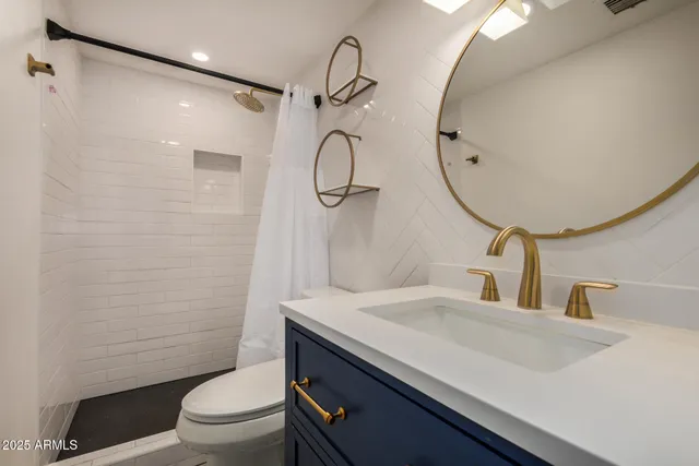 a kitchen with stainless steel appliances a sink stove and a refrigerator