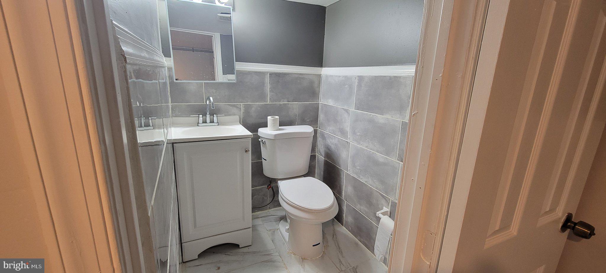 209 North 10th Street Darby, PA 19023 - Photo 14 of 26 Modern bathroom with sleek finishes.