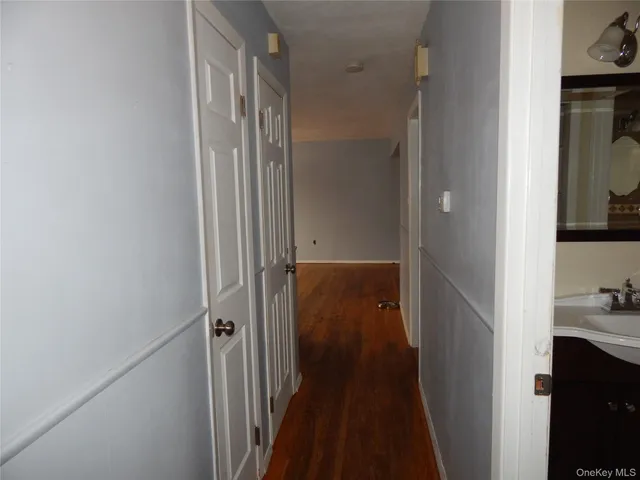 a view of a bathroom from a hallway