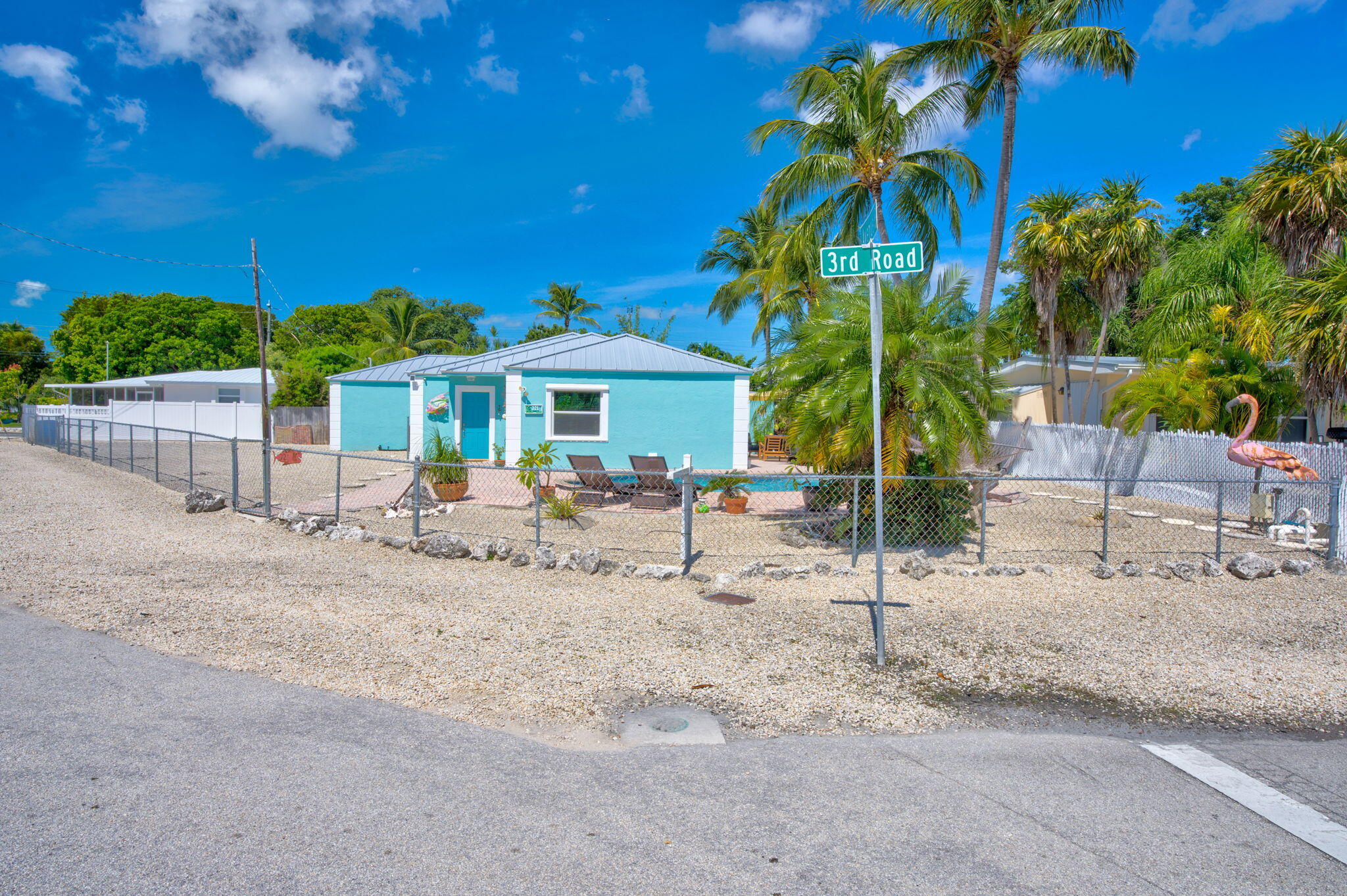 321 3rd Road Key Largo, FL 33037 - Photo 12 of 45 a view of a patio with a table and chairs under an umbrella