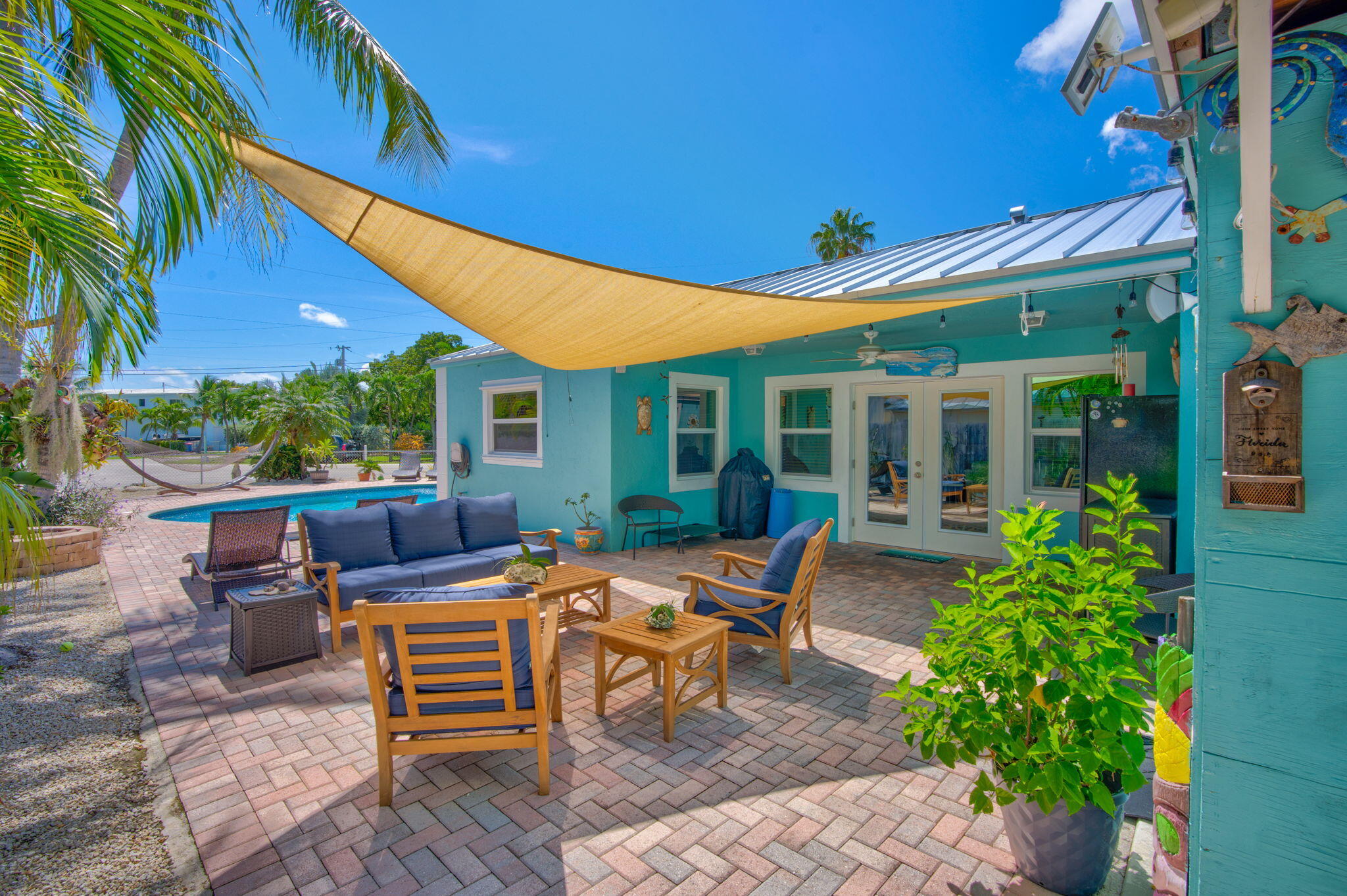 321 3rd Road Key Largo, FL 33037 - Photo 15 of 45 a view of a house with backyard sitting area and garden