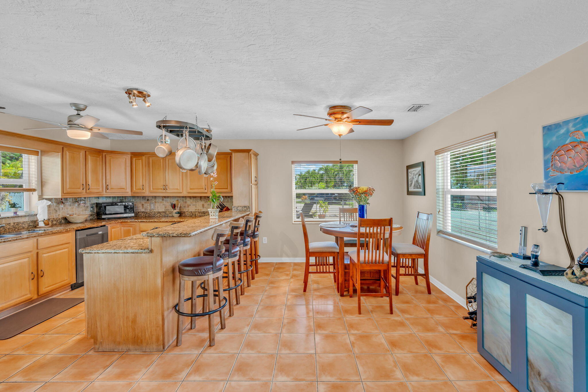 321 3rd Road Key Largo, FL 33037 - Photo 16 of 45 a dining hall with stainless steel appliances granite countertop a stove and a dining table view