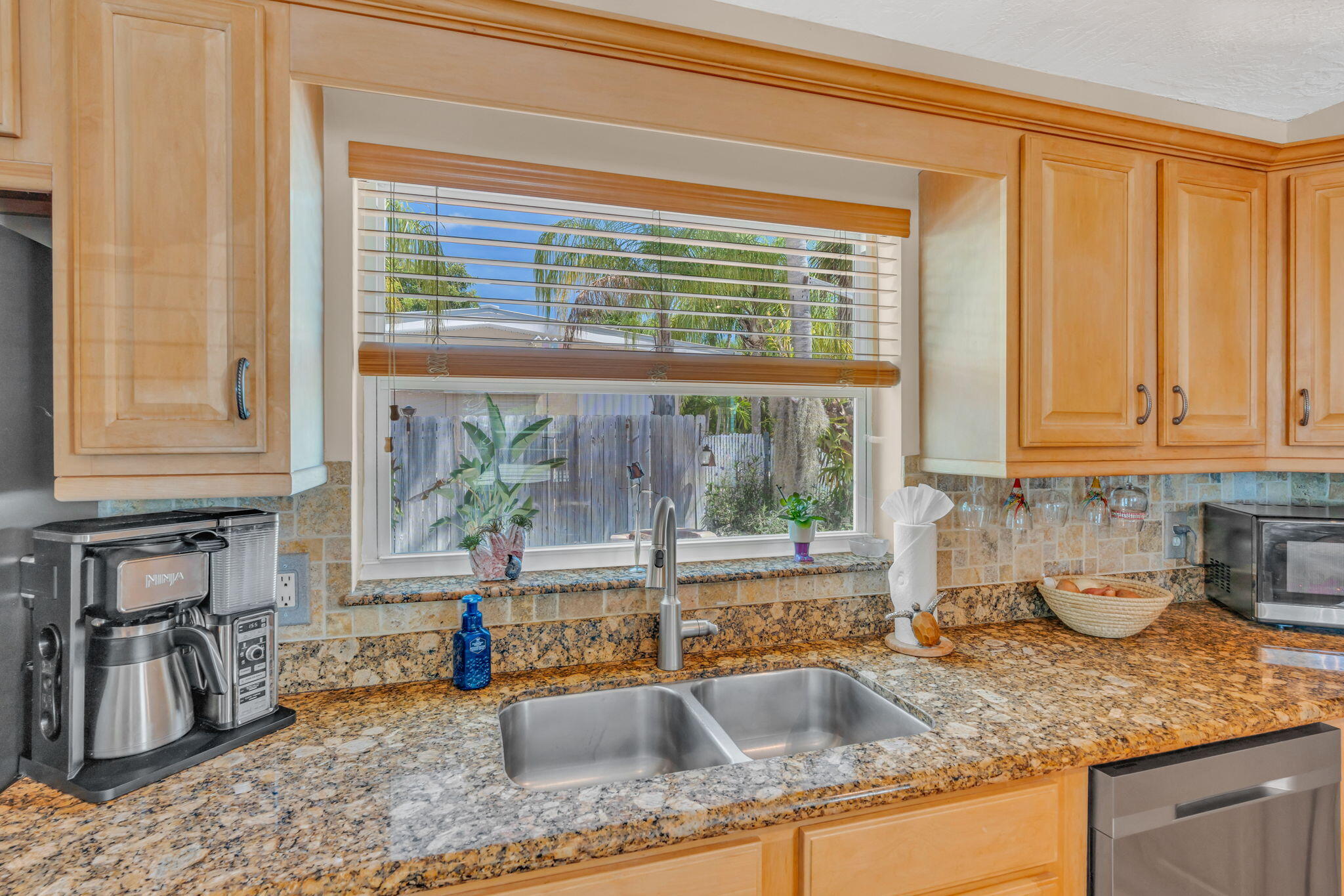 321 3rd Road Key Largo, FL 33037 - Photo 19 of 45 a kitchen with granite countertop a sink and a window