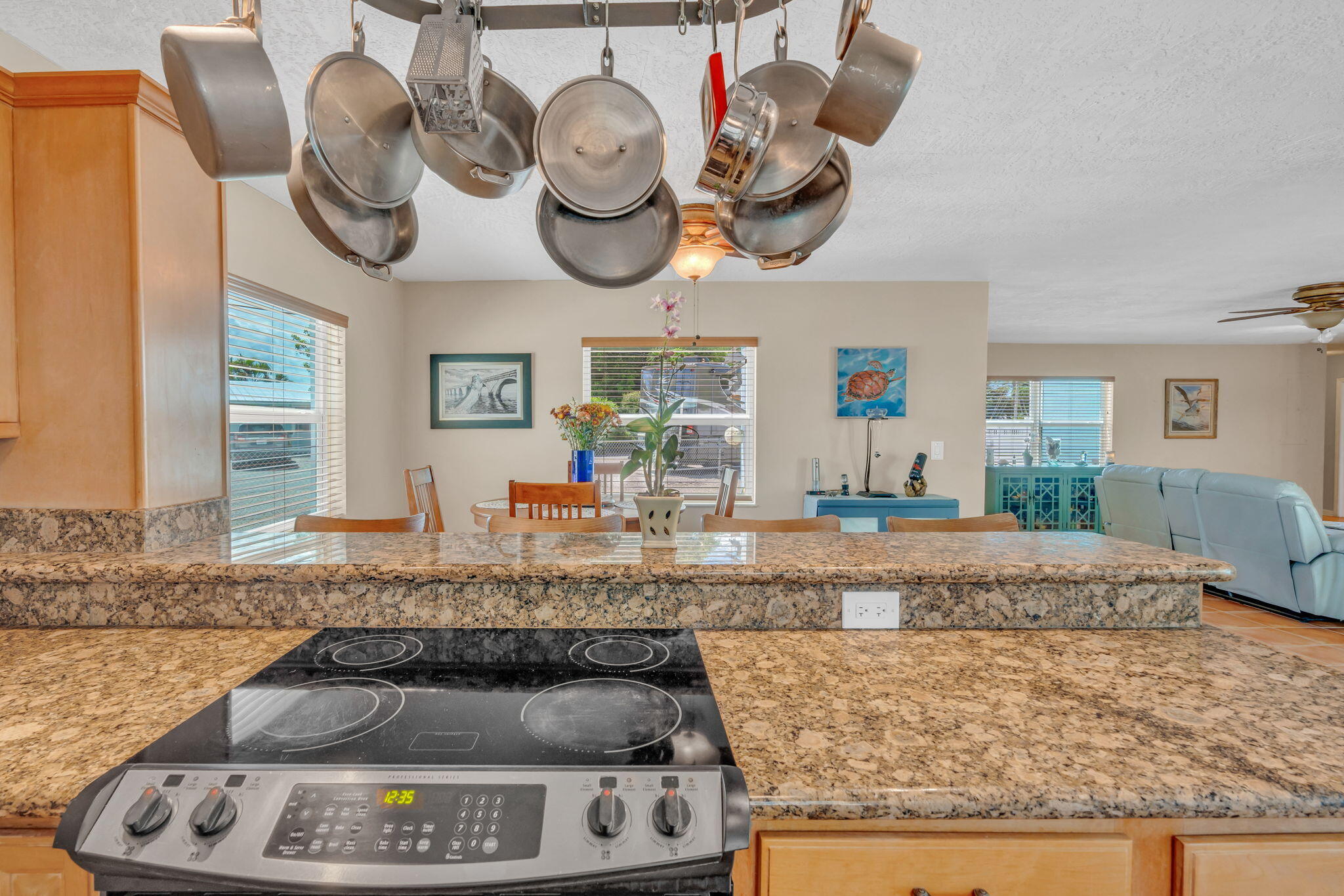 321 3rd Road Key Largo, FL 33037 - Photo 20 of 45 a kitchen with kitchen island granite countertop a stove and a sink