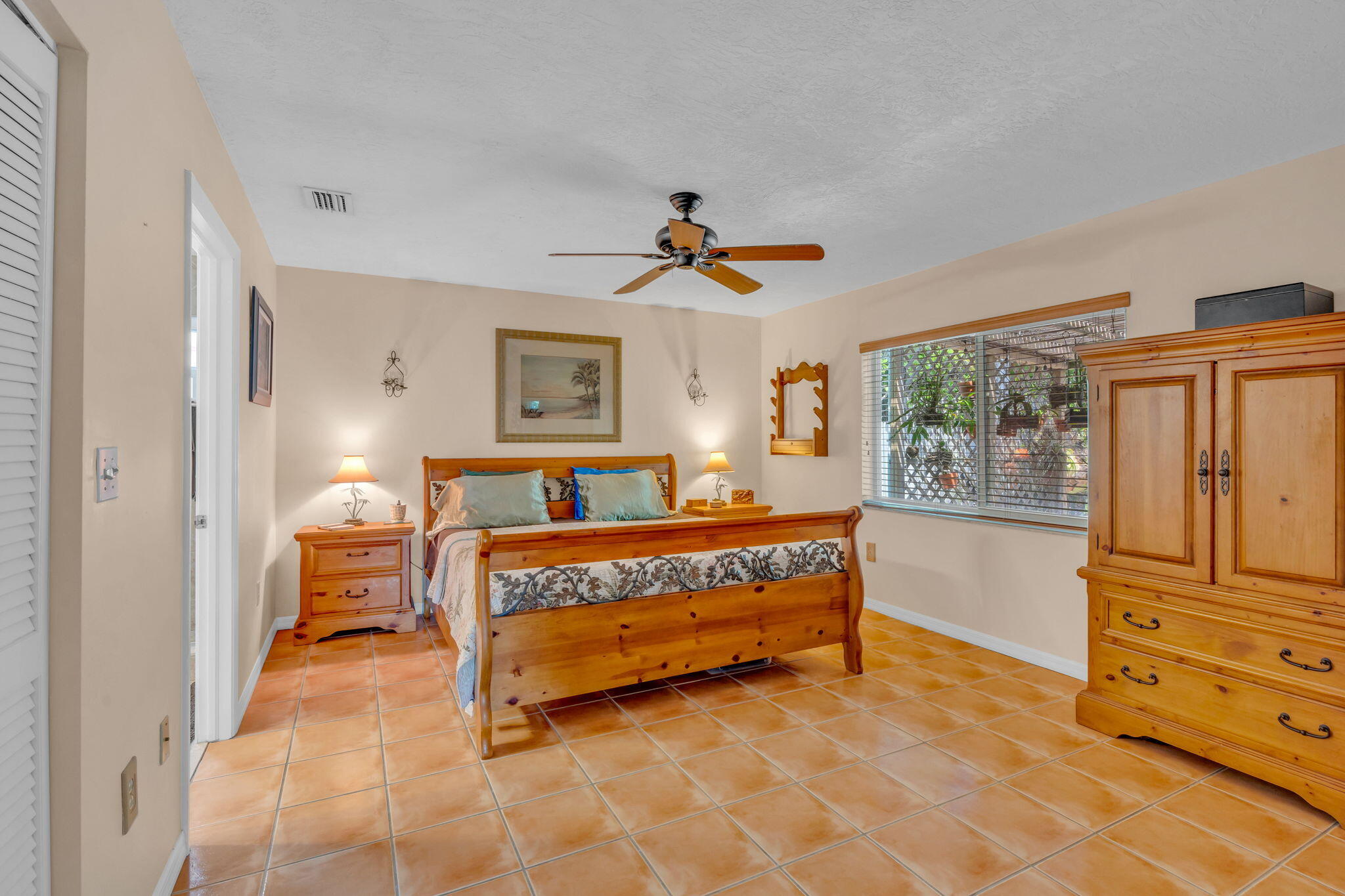 321 3rd Road Key Largo, FL 33037 - Photo 27 of 45 a spacious bedroom with a bed and window