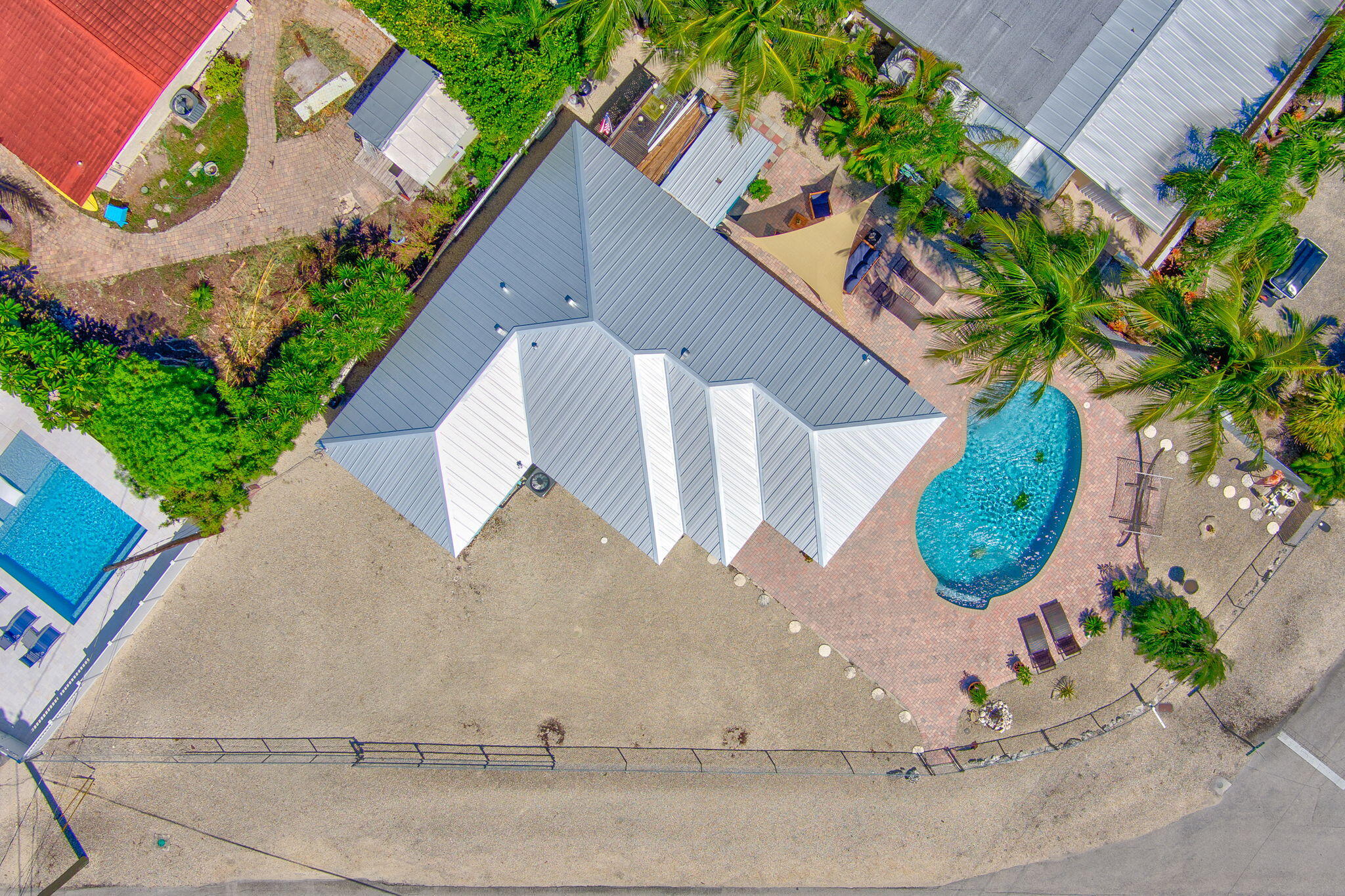 321 3rd Road Key Largo, FL 33037 - Photo 3 of 45 an aerial view of a house with a yard and potted plants