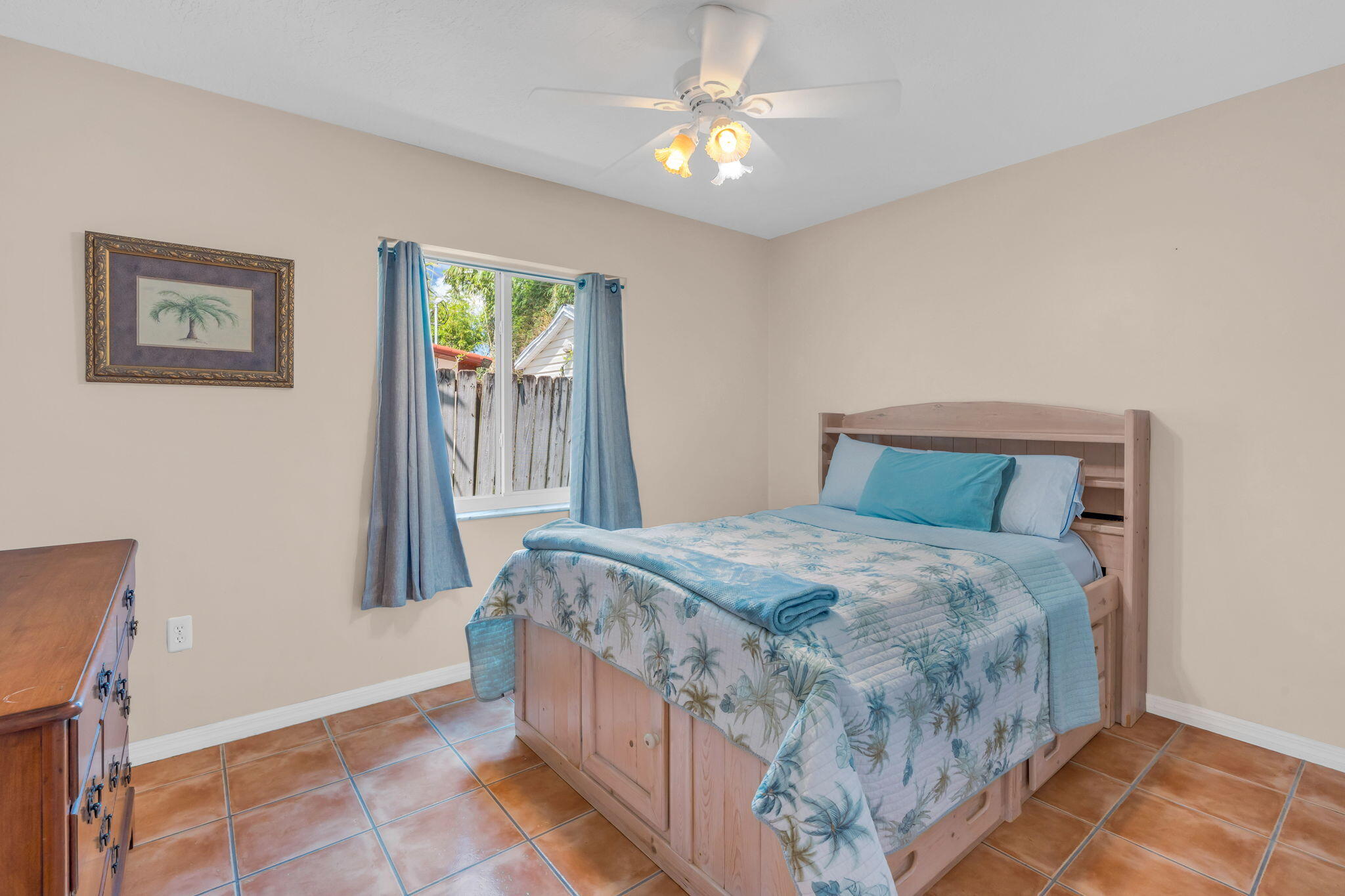 321 3rd Road Key Largo, FL 33037 - Photo 34 of 45 a bedroom with a bed and a chandelier