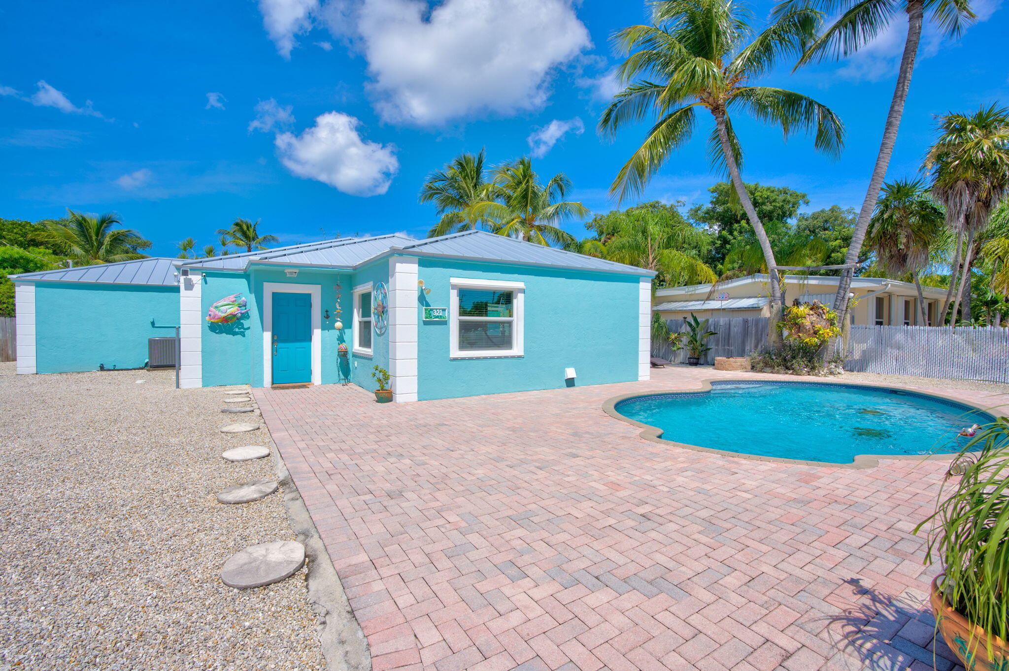 321 3rd Road Key Largo, FL 33037 - Photo 4 of 45 a view of a house with a swimming pool