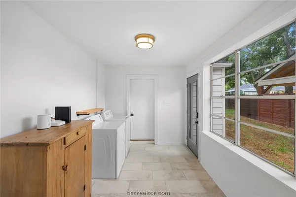 a view of kitchen with furniture and window