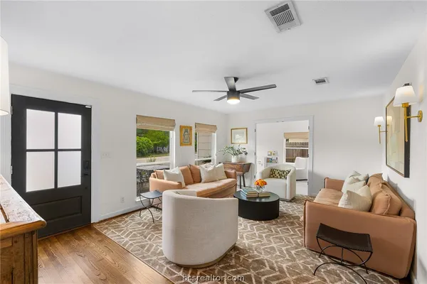 a living room with furniture and a large window
