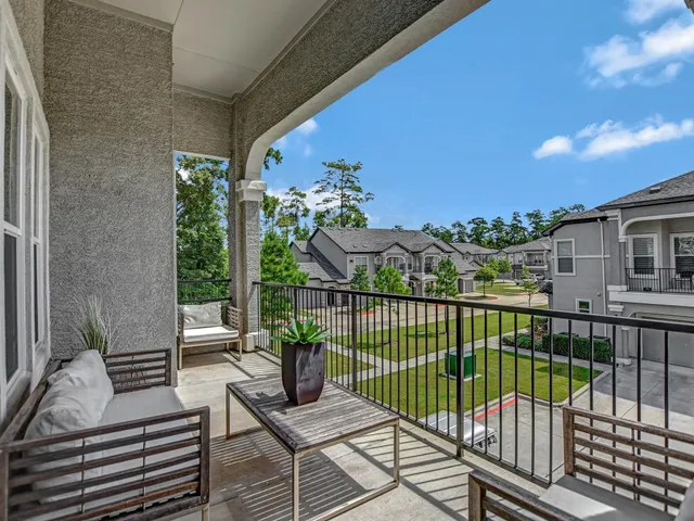 a view of a balcony with furniture
