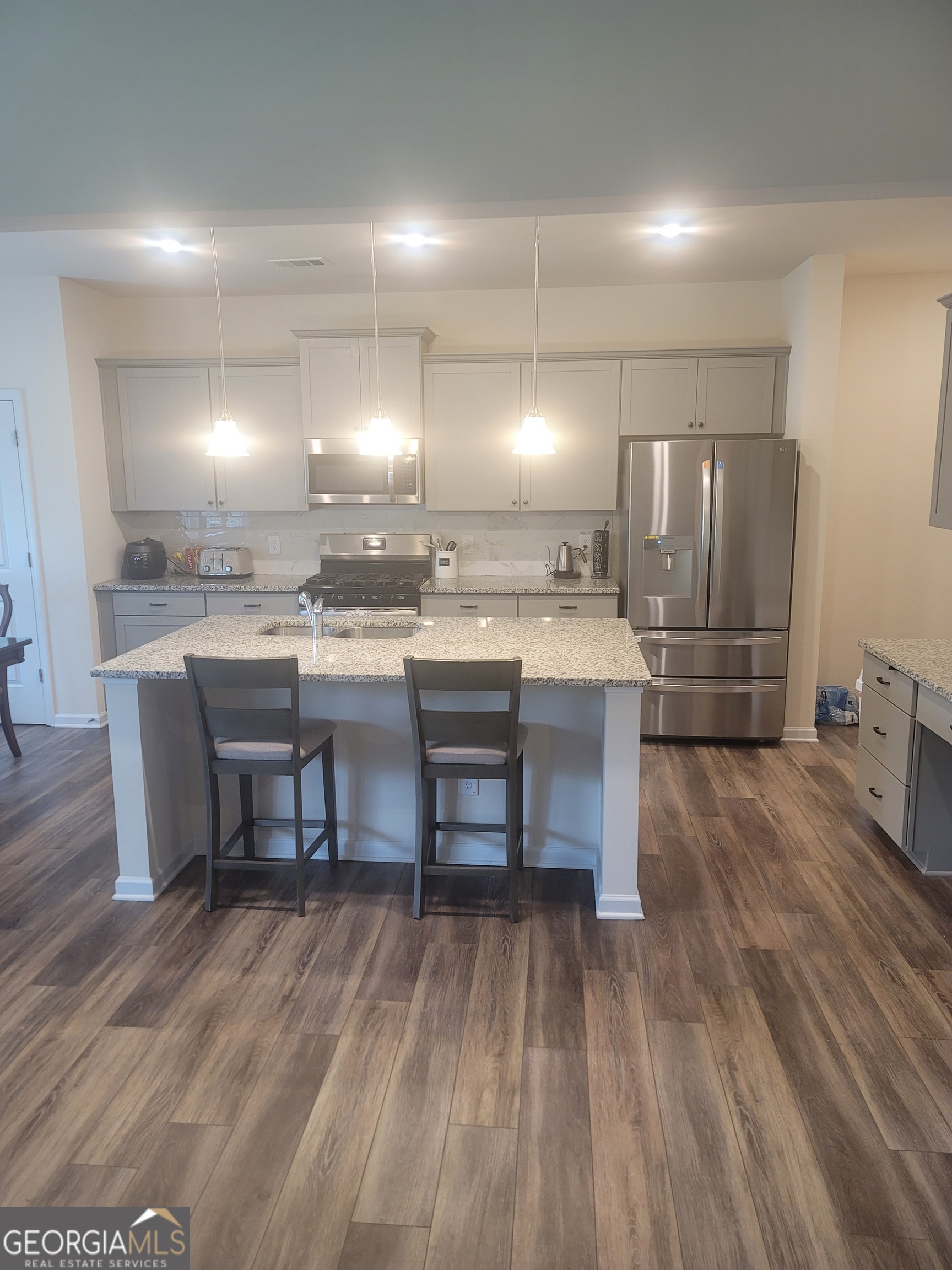 102 Potters Fields Northwest Cartersville, GA 30121 - Photo 15 of 36 a kitchen with a sink cabinets and wooden floor