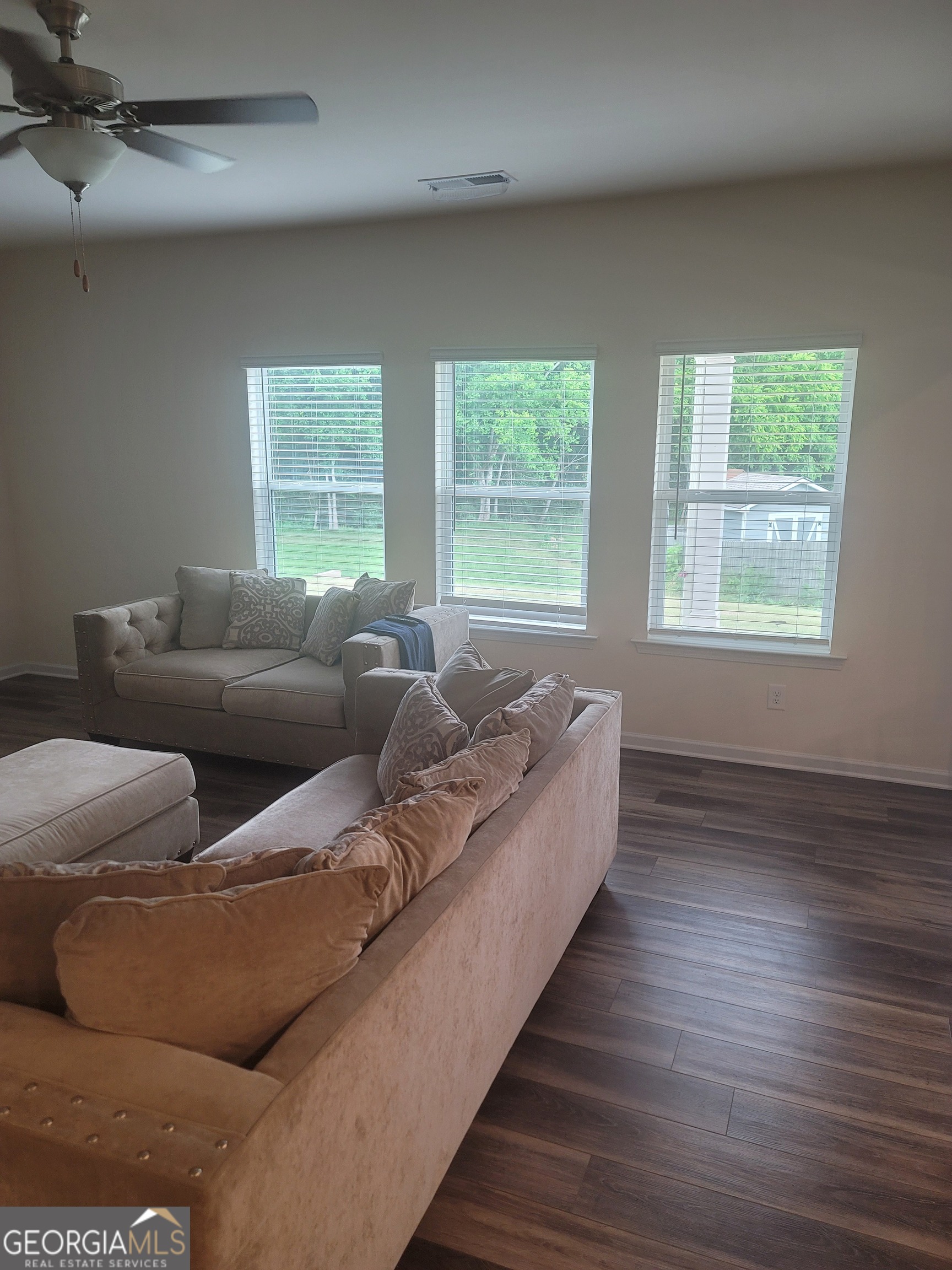 102 Potters Fields Northwest Cartersville, GA 30121 - Photo 17 of 36 a living room with couches and a large window