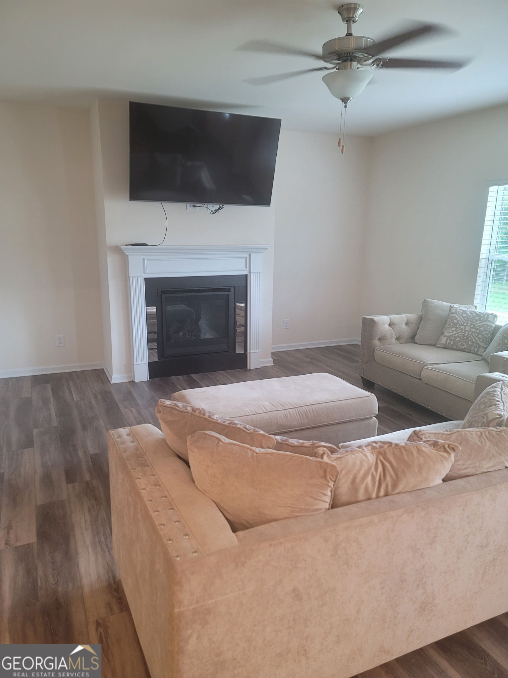 102 Potters Fields Northwest Cartersville, GA 30121 - Photo 18 of 36 a living room with furniture and a fireplace