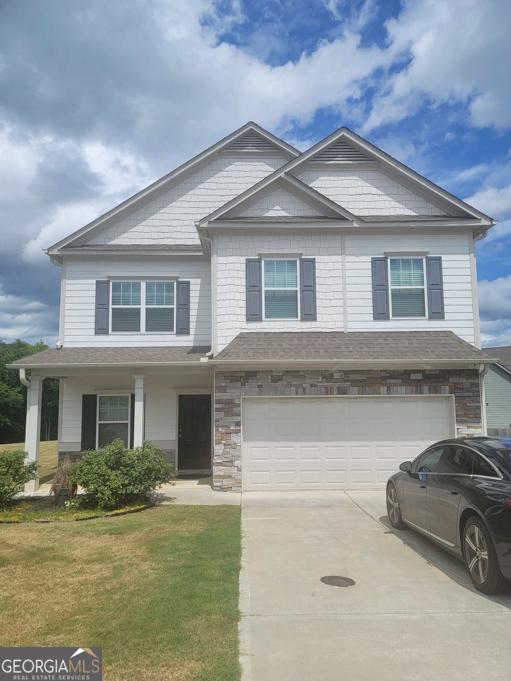 102 Potters Fields Northwest Cartersville, GA 30121 - Photo 2 of 36 front view of a house with a yard