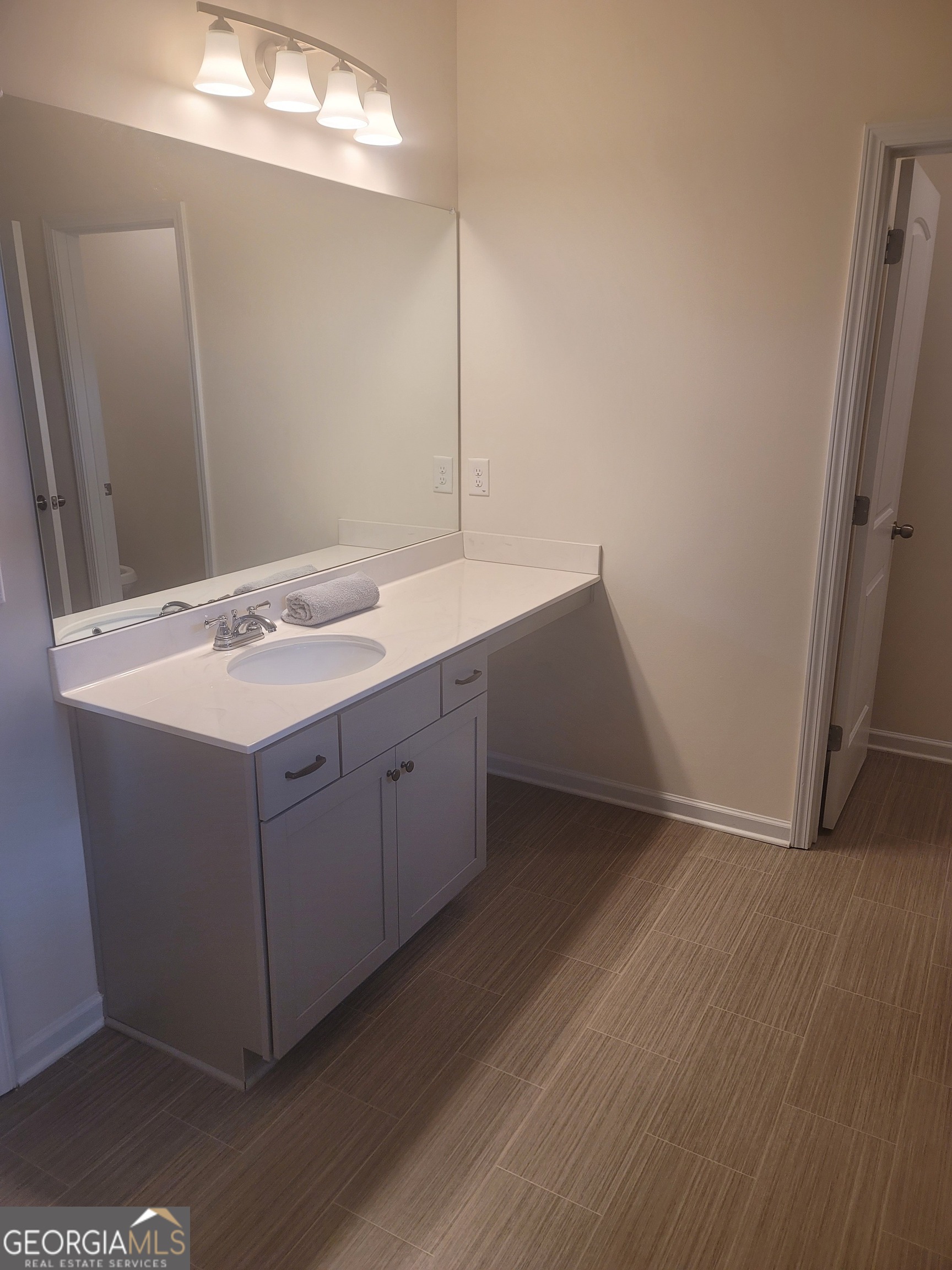 102 Potters Fields Northwest Cartersville, GA 30121 - Photo 30 of 36 a room with a sink cabinets and wooden floor