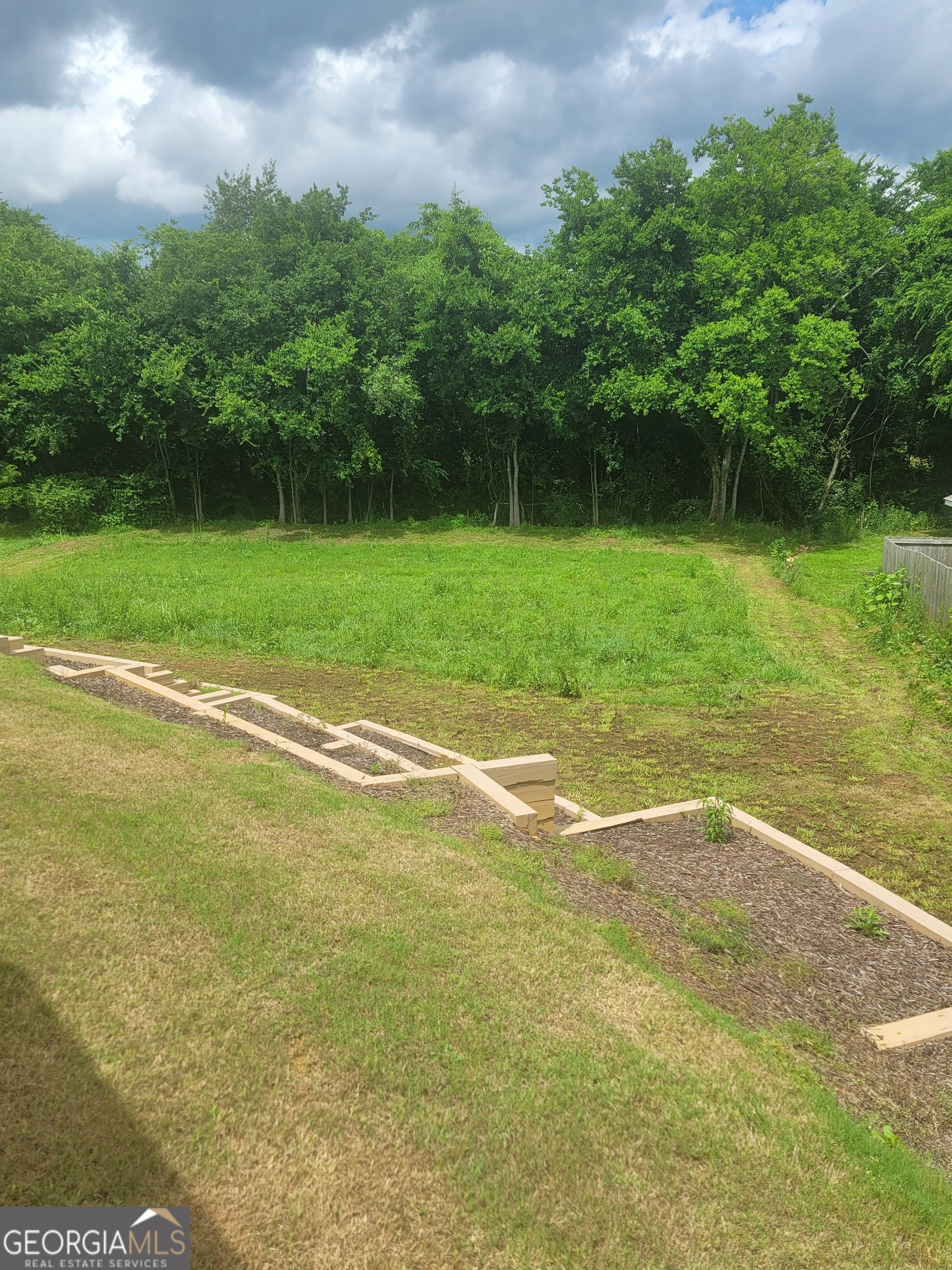 102 Potters Fields Northwest Cartersville, GA 30121 - Photo 5 of 36 a view of a garden with a lake view