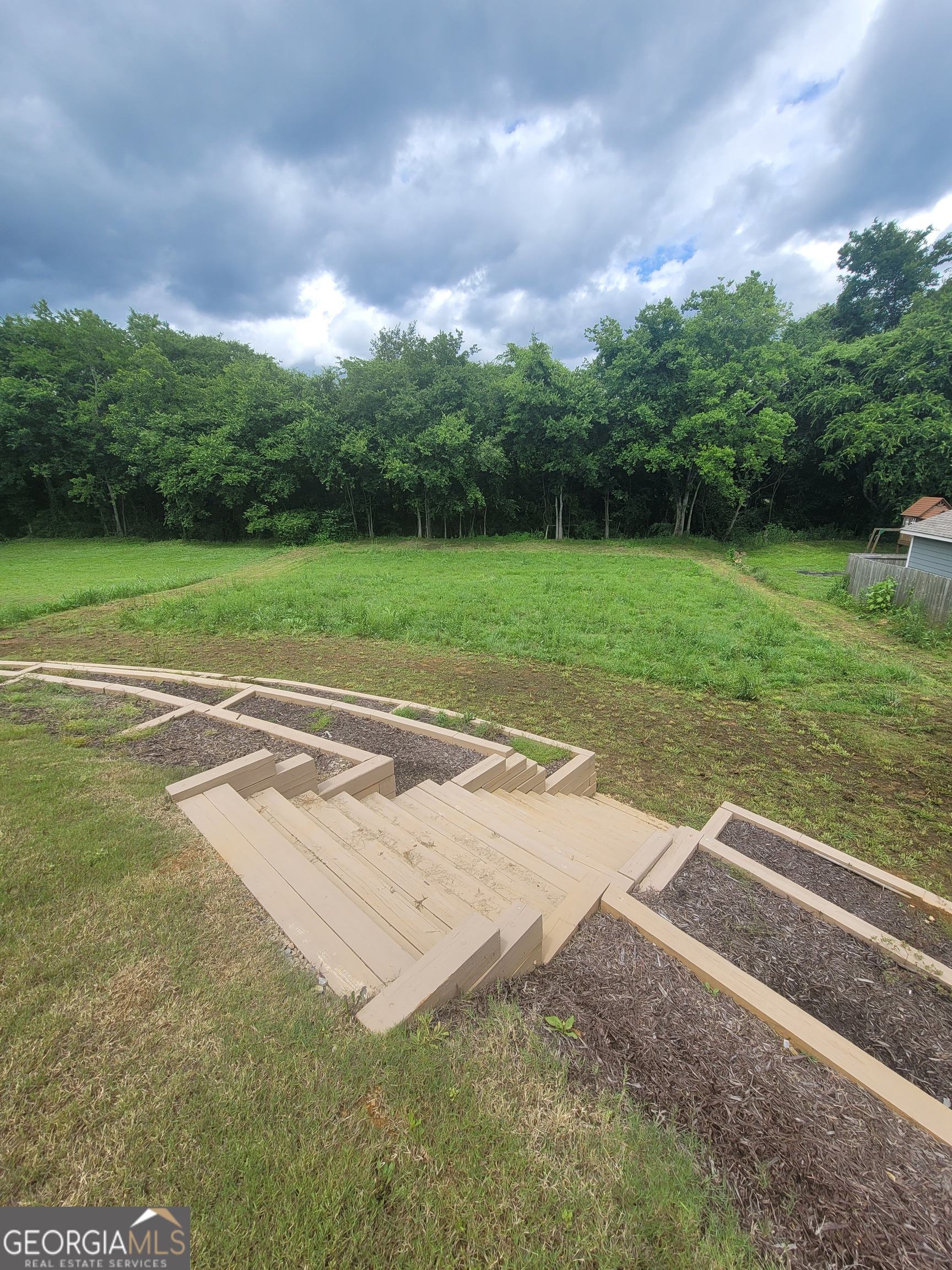 102 Potters Fields Northwest Cartersville, GA 30121 - Photo 6 of 36 a view of a backyard