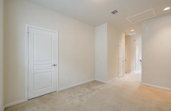 an empty room with a empty space and windows