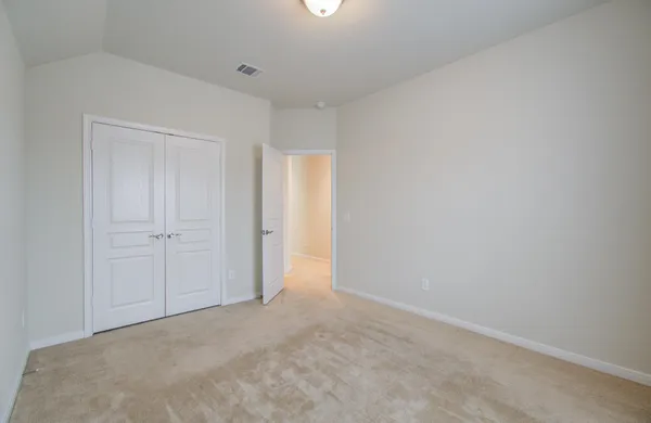a view of a room with cabinets and a window