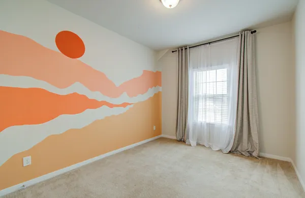 a view of an empty room and closet area