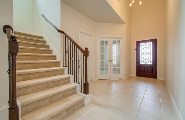 a view of entryway with bedroom and workspace