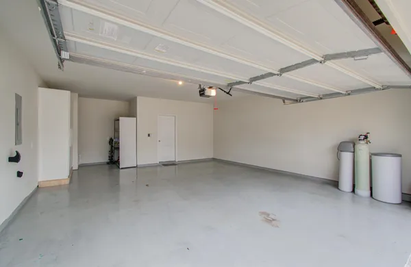 a view of a backyard with table and chairs