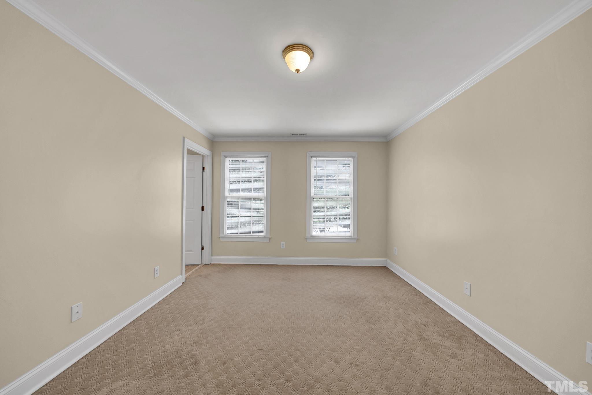 1012 Tyrrell Road Raleigh, NC 27609 - Photo 16 of 24 a view of an empty room with a window