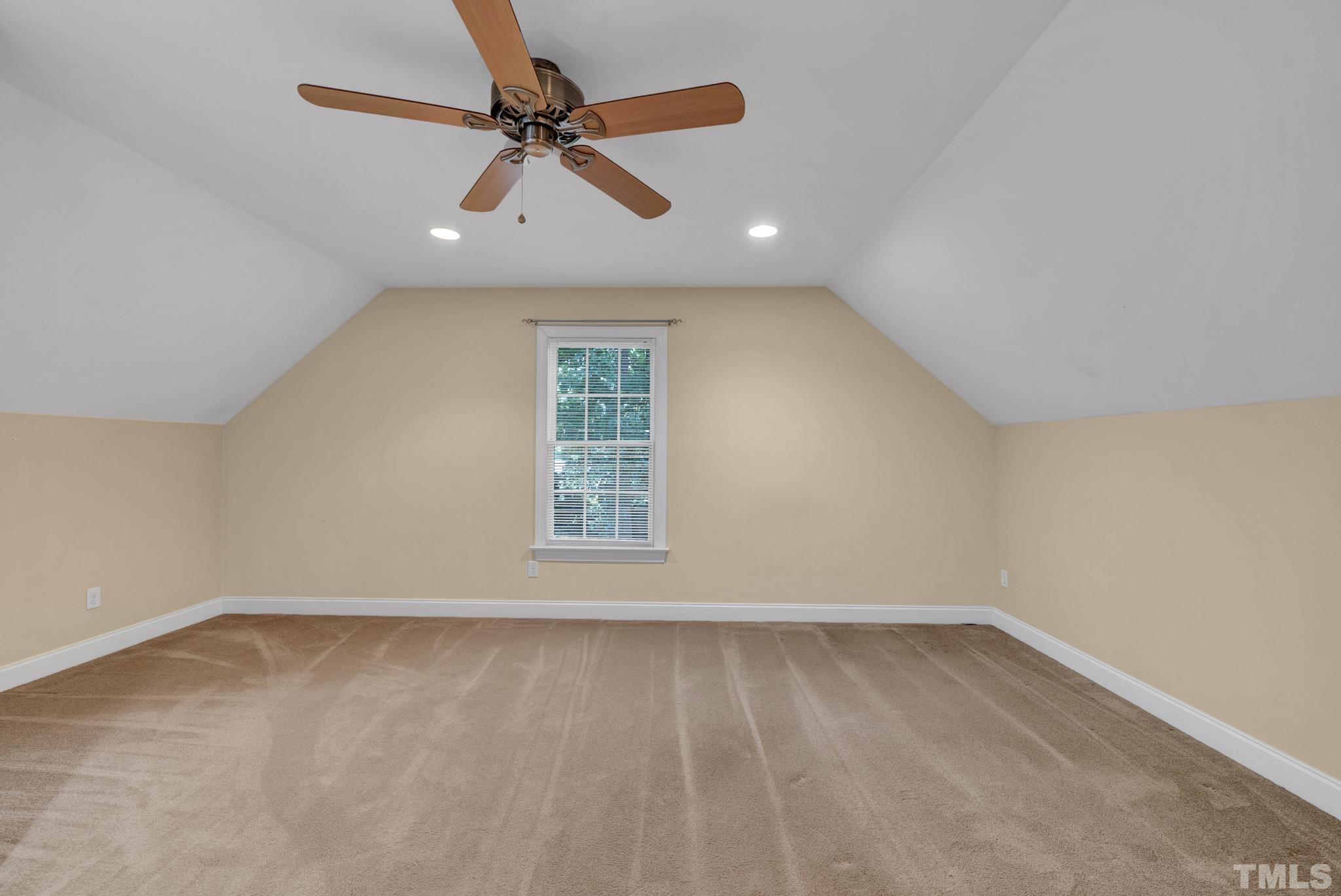 1012 Tyrrell Road Raleigh, NC 27609 - Photo 20 of 24 an empty room with a window and ceiling fan