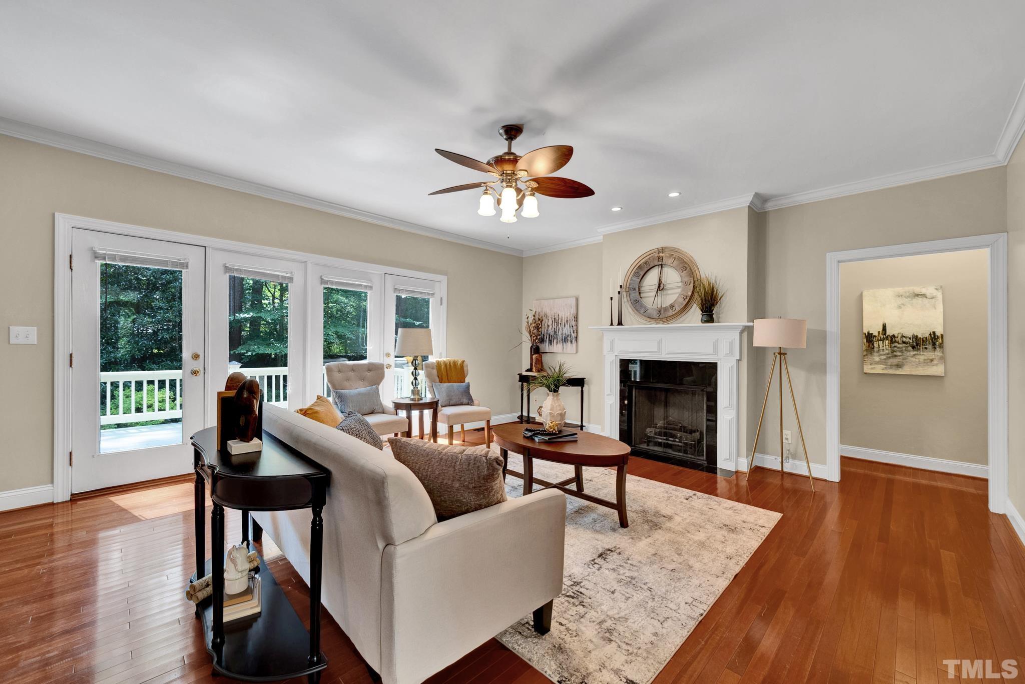 1012 Tyrrell Road Raleigh, NC 27609 - Photo 4 of 24 a living room with furniture and a fireplace