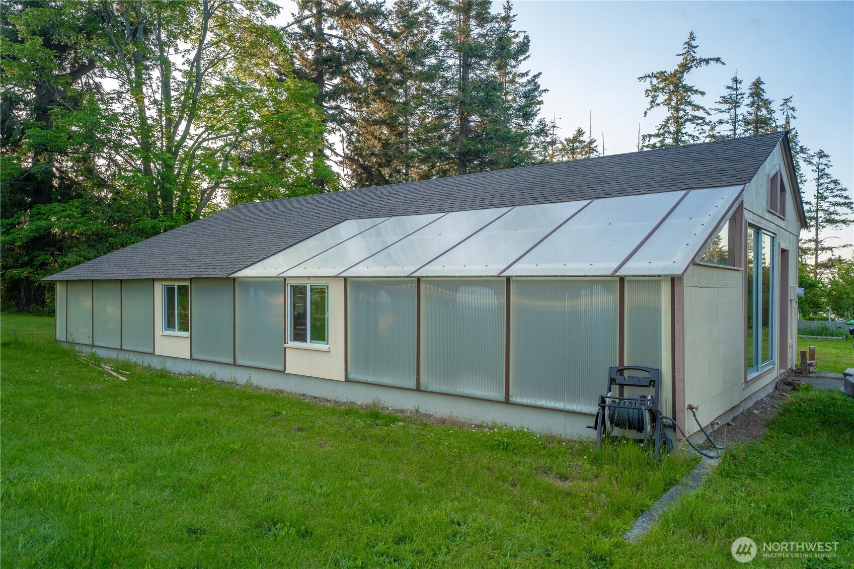 491 Bachelor Road Sequim, WA 98382 - Photo 36 of 39 a backyard of a house with table and chairs