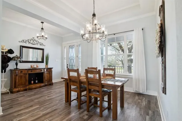 a kitchen with granite countertop white cabinets and a stove