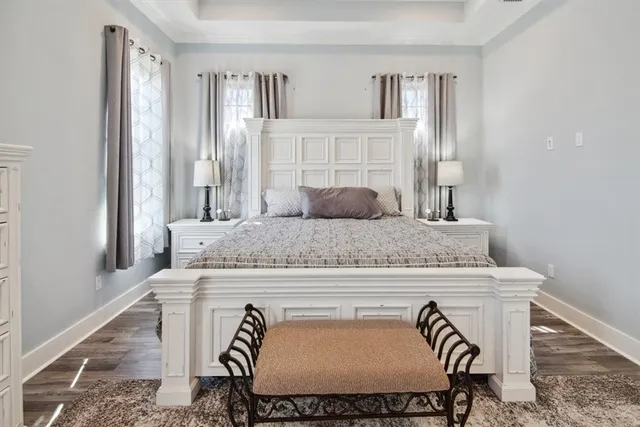a view of a dining room with furniture a chandelier and wooden floor